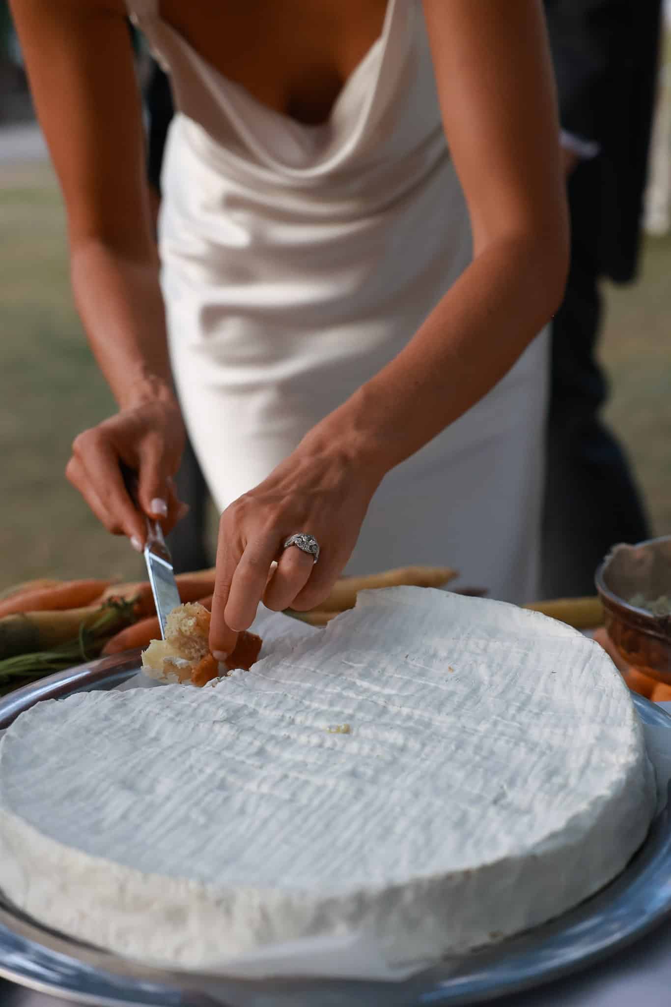 the bride cutting cheese