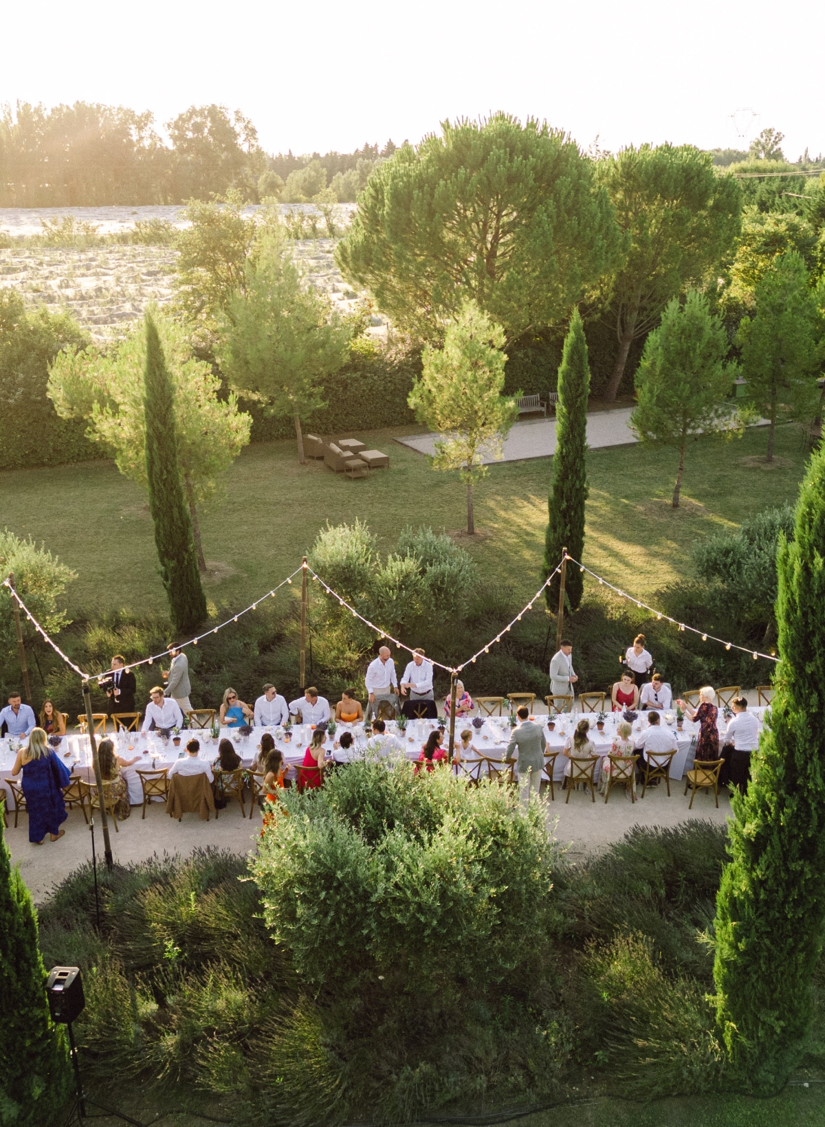 Family and friends with a sunset